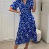White Floral Print Midi Wrap Dress With Belt Fastening In Blue 1 White Floral Print Midi Wrap Dress With Belt Fastening In Blue -UK Skirt Sales 2023 2023 02 22 Mollie Danna29